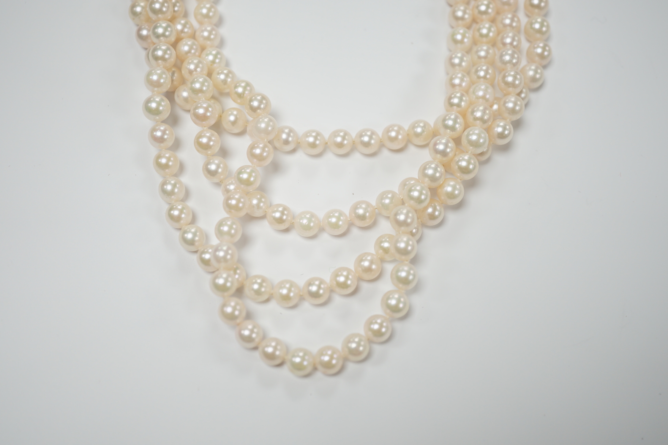 A quadruple strand cultured pearl choker necklace, with emerald and diamond chip set 750 white metal clasp, 32cm.